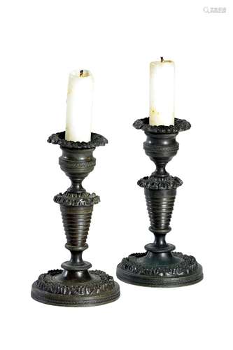 A PAIR OF GEORGE IV BRONZE MINIATURE CANDLESTICKS