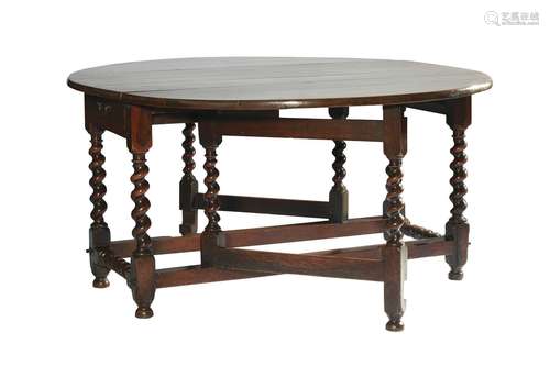 A JACOBEAN OAK DROPLEAF DINING TABLE