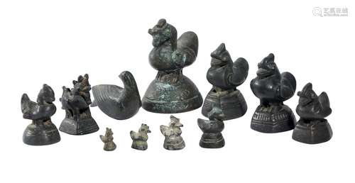 A GROUP OF TEN BRONZE OPIUM WEIGHTS AND ANOTHER BRONZE