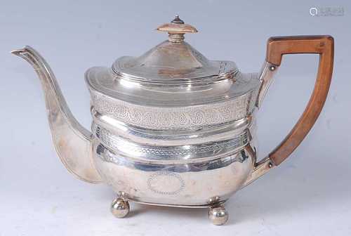 A George III silver teapot, of bombe form, having horizontal...