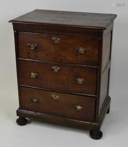 An early 18th century joined oak chest, of three long drawer...