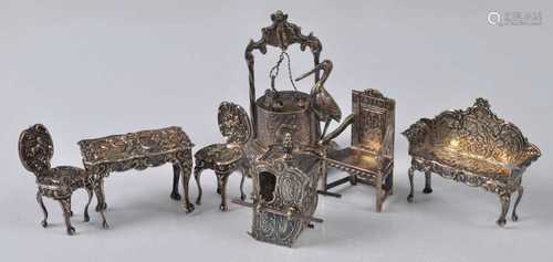 A collection of Edwardian silver dolls house furniture, comp...