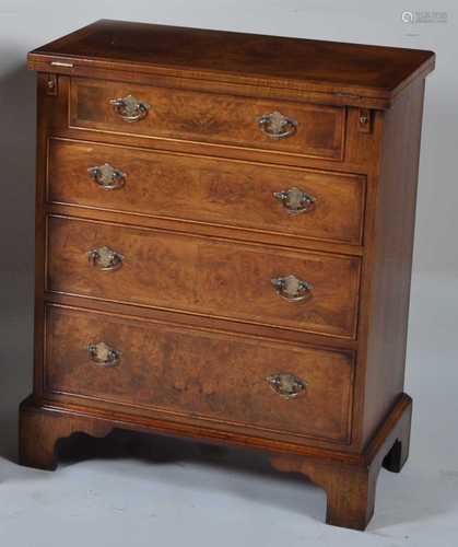 A walnut and figured walnut bachelors chest, in the early 18...