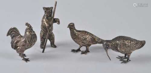 A collection of four various silver miniature animal ornamen...