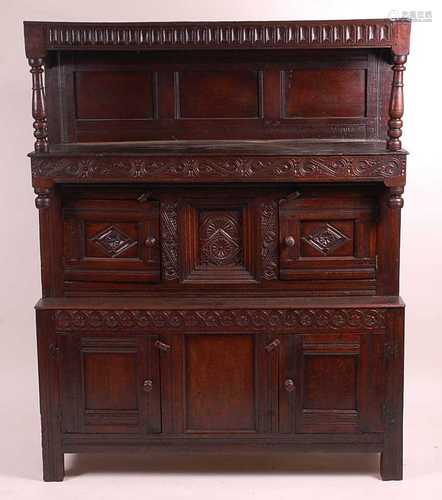 An antique joined oak tridarn, the raised three panel back w...