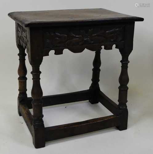 An early 18th century oak joint stool, the one-piece top wit...