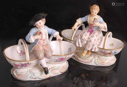 A pair of Meissen porcelain table salts, modelled as a man a...