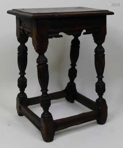 A circa 1700 oak joint stool, the one-piece top having a mou...