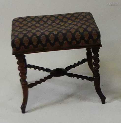 A Victorian rosewood footstool, having a woolwork stuffover ...