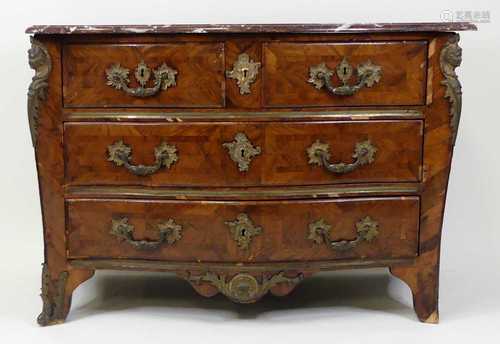 An 18th century French provincial walnut commode, of serpent...