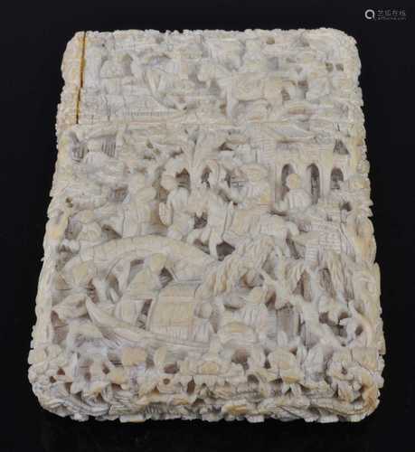 A 19th century Chinese Canton ivory card case, deeply carved...