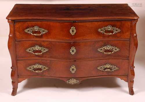 An 18th century French provincial walnut commode, having a s...