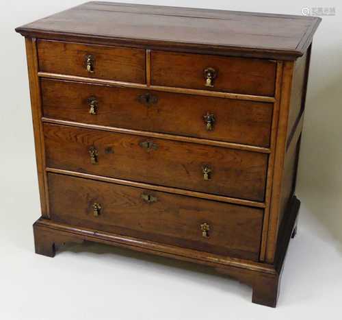 An early 18th century oak chest, of two short and three long...