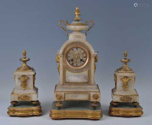 A Victorian alabaster gilt metal mounted three-piece clock g...