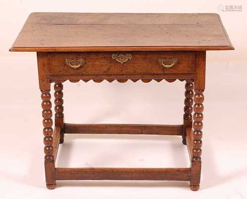 A circa 1700 joined oak side table, having a two-plank top w...