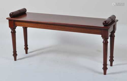 A Victorian style mahogany window seat, with turned ends and...