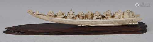 A Japanese Meiji period ivory tusk carving, as eight figures...