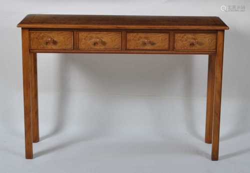 An oak and burr oak hall table, in the Georgian style, havin...