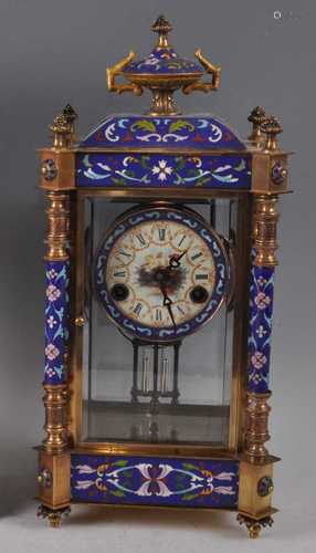 A reproduction gilt brass and enamel four glass mantel clock...