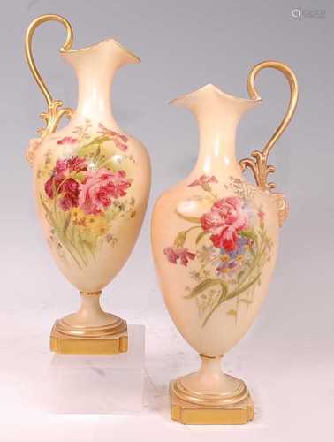 A pair of Edwardian Royal Worcester porcelain pedestal ewers...