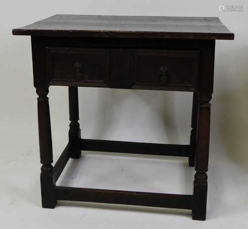 An early 18th century joined oak side table, having a two-pl...