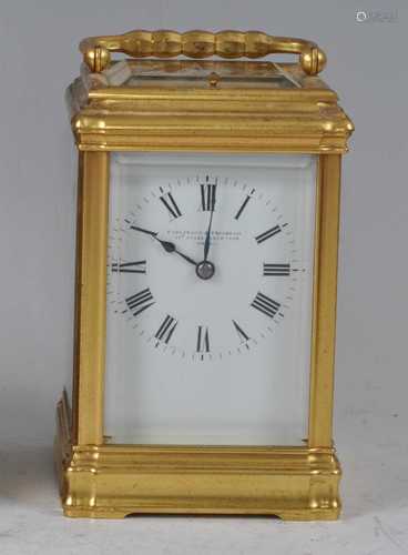 A circa 1900 gilt brass striking carriage clock by Parkinson...