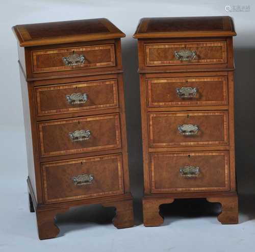 A pair of walnut and figured walnut bedside chests, each hav...