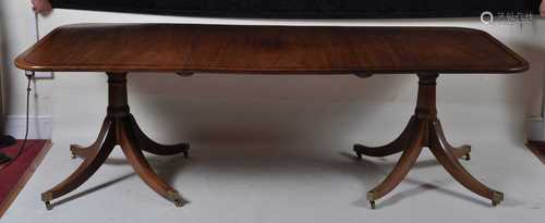 A mahogany twin pedestal dining table, the 19th century top ...