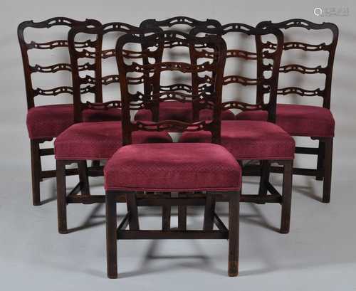 A set of six George III mahogany dining chairs, having pierc...