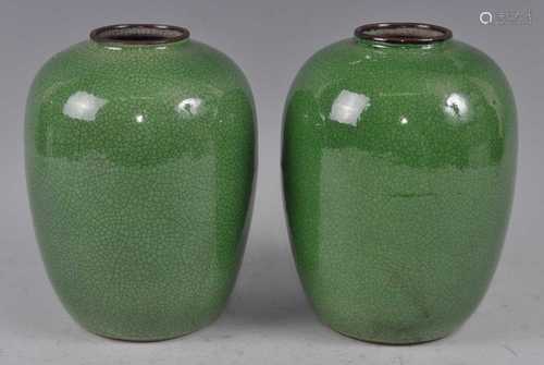 A pair of Chinese green crackle-glazed vases, each of barrel...