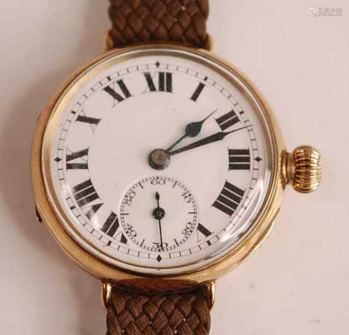 A 9ct yellow gold manual wind trench watch, having a round w...