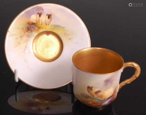 A Royal Worcester porcelain miniature cabinet cup and saucer...