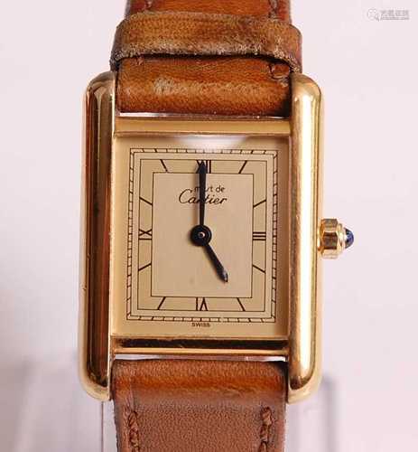 A lady's Must de Cartier quartz tank watch, in silver gilt, ...