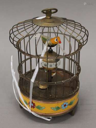 A cloisonne birdcage clock. 21 cm high.