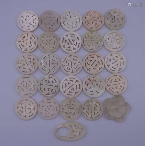 A quantity of jade carvings. Majority 2.5 cm diameter.