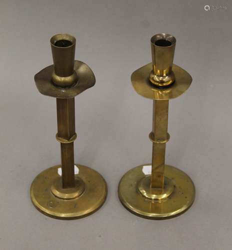 A pair of Arts & Crafts brass candlesticks. 21.5 cm high.