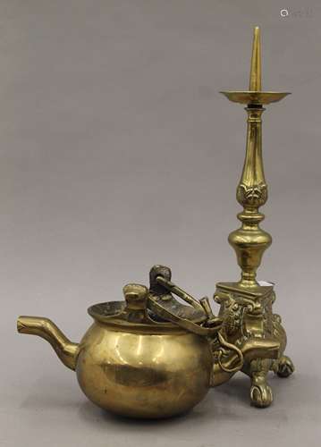 An antique double spouted brass cooking pot with swing handl...