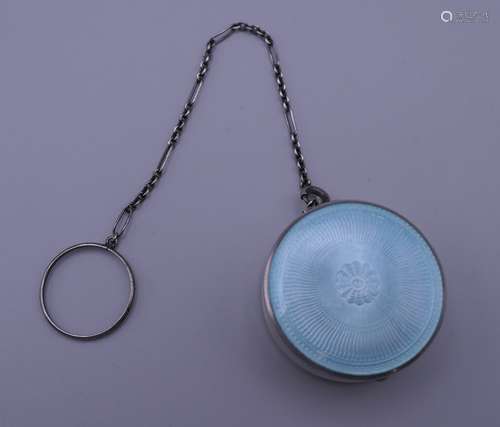 A silver and blue enamel pill box on chain. Pill box 3 cm di...