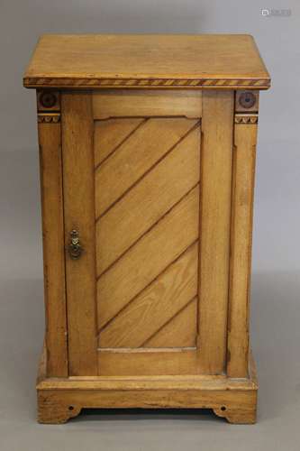 An Arts and Crafts inlaid ash pot cupboard, en-suite (see al...