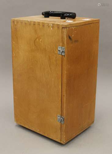 A cased microscope. The case 33.5 cm high.