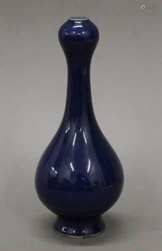 A small Chinese porcelain blue ground onion shaped vase. 17 ...