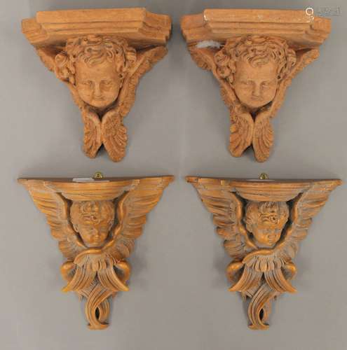 A pair of terracotta angel form wall brackets and another pa...