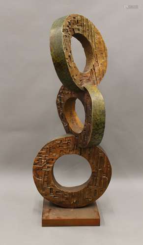 A large bronze circular abstract sculpture. 125 cm high.