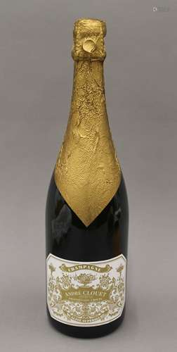 A bottle of Andre Clouet Un Jour De 1911 Grand Cru, in a woo...