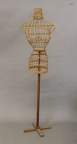 A wicker work and pine mannequin.