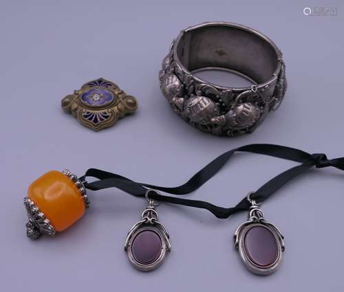 A quantity of jewellery, including two silver fobs. Fobs 2 c...