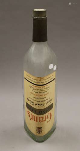 A large empty vintage Grant's Finest Scotch Whisky bottle. 5...