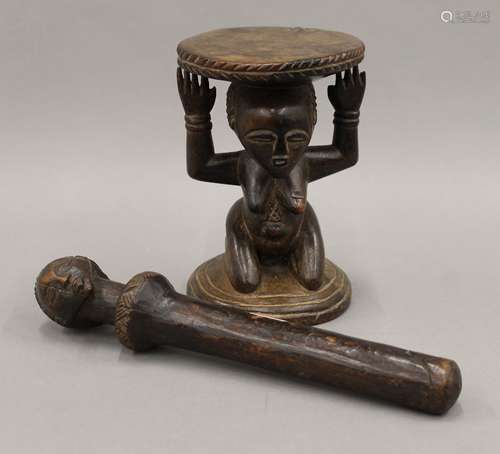 A small tribal wooden stool and a tribal fertility staff fro...