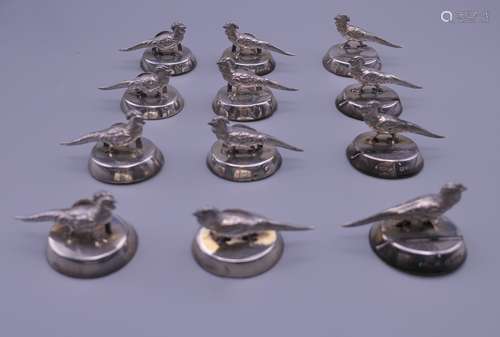 Twelve silver pheasant place name holders. 4.5 cm wide x 3 c...