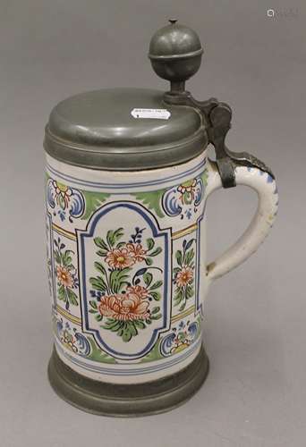 An 18th/19th century German pottery pewter lidded stein with...